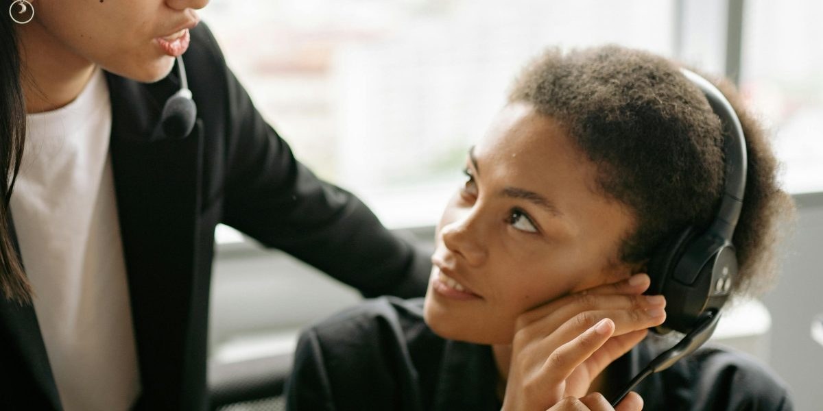 Sales professional coaching a trainee