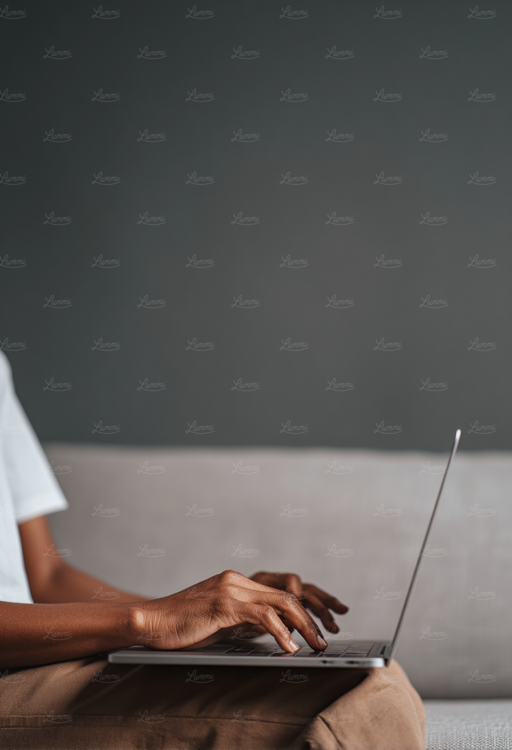 An individual focused on a laptop screen, navigating online job boards to find remote healthcare IT opportunities.